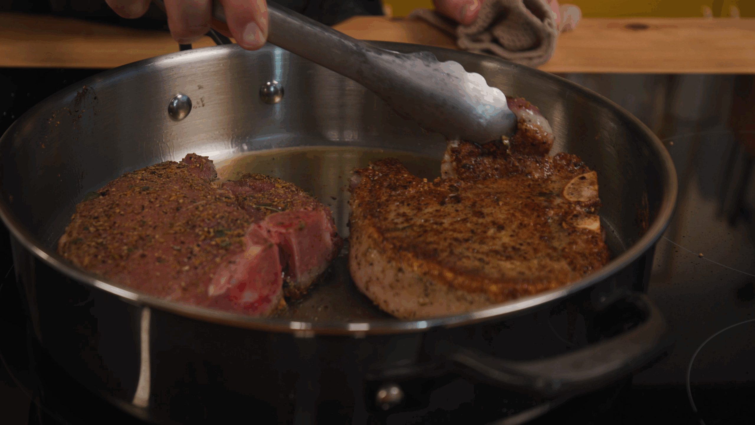 porkchop seared in stainless steel pan